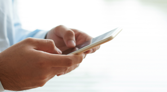 An employee using infithra's self service portal through a mobile phone